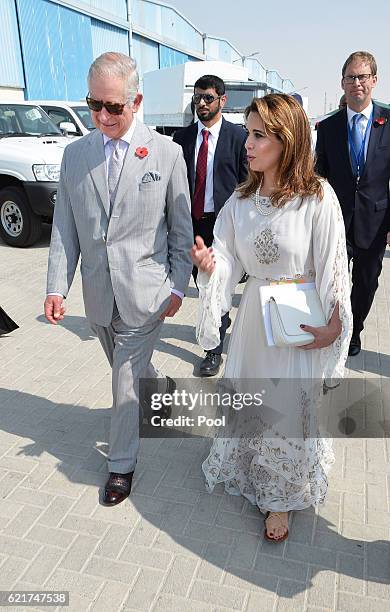 Princess Haya of Jordan walks with Prince Charles, Prince of Wales as they tour the International Humanitarian City to see the innovation and best...