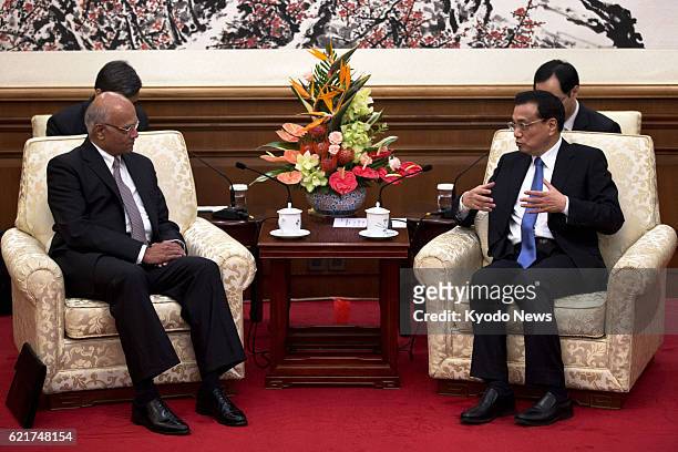 China - India's National Security Adviser Shiv Shankar Menon and Chinese Premier Li Keqiang meet at the Diaoyutai State Guesthouse in Beijing on June...