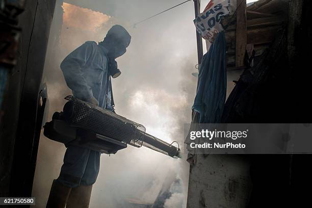 Health worker did Aedes aegypti fogging most densely populated areas in Lhokseumawe, Aceh province, Indonesia, on November 7, 2016. The fumigation is...