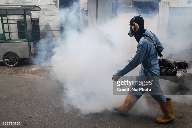 Health worker did Aedes aegypti fogging most densely populated areas in Lhokseumawe, Aceh province, Indonesia, on November 7, 2016. The fumigation is...