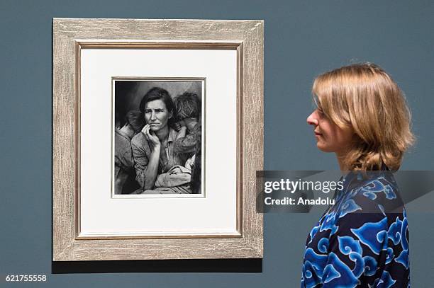 Tate Modern staff views photograph titled One of the Homeless Wandering Boys by photographer Dorothea Lange on November 08, 2016 in London, England....