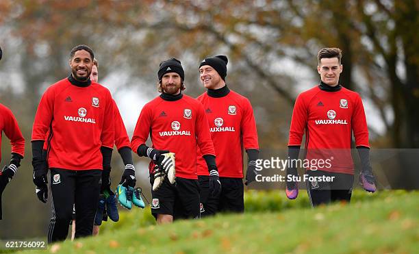 Wales captain Ashley Williams shares a joke with Joe Allen and David Cotterill as the team make their way to training ahead of their World Cup...