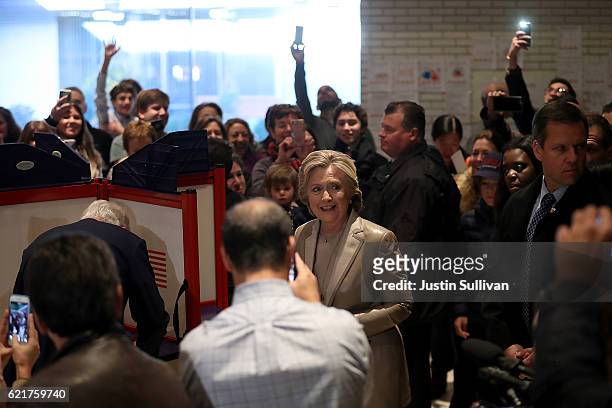 Democratic presidential nominee former Secretary of State Hillary Clinton is surrounded by people as she votes at Douglas Grafflin Elementary School...