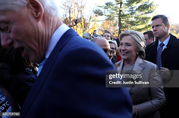 Democratic presidential nominee former Secretary of State Hillary Clinton and her husband former U.S. President Bill Clinton greet supporters after...