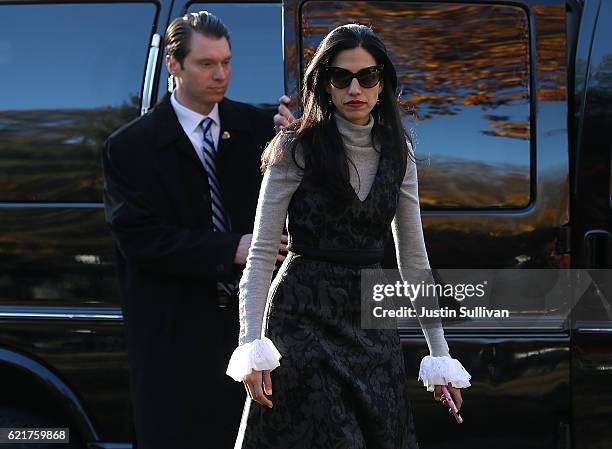 Huma Abedin, aide to Democratic presidential nominee former Secretary of State Hillary Clinton, walks to the motorcade after Hillary voted at Douglas...