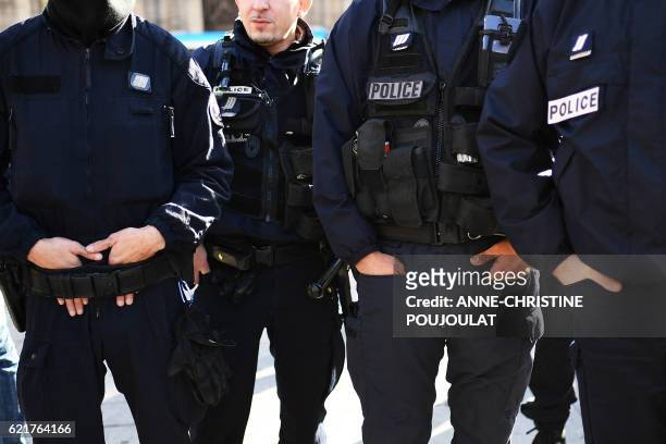 French police officers demonstrate in Marseille, southern France, on November 8 one month after four officers were injured when a group of youths...