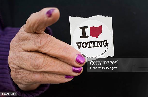 Woman holds her voting sticker in her hand after casting her ballot at the Leetonia American Legion Post 131 obn November 8, 2016 in Leetonia, Ohio....