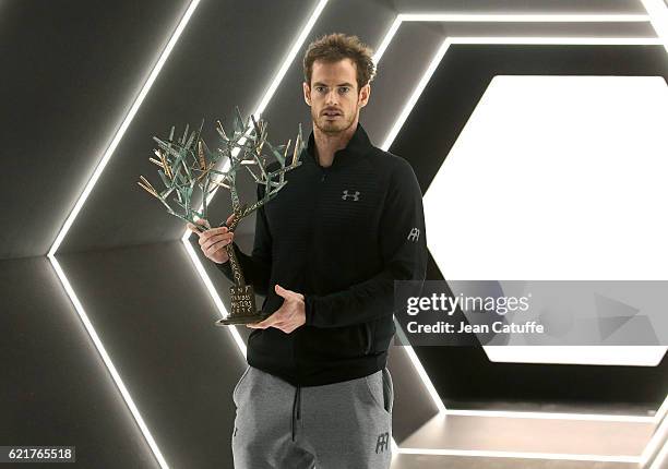 Winner Andy Murray of Great Britain holds the trophy following the final of the Paris ATP Masters Series 1000 at AccorHotel Arena aka Palais...