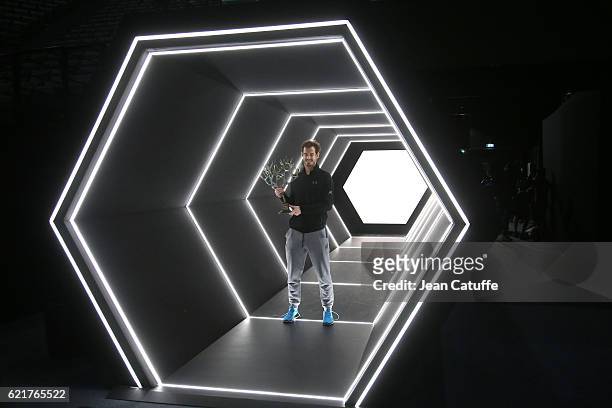 Winner Andy Murray of Great Britain holds the trophy following the final of the Paris ATP Masters Series 1000 at AccorHotel Arena aka Palais...