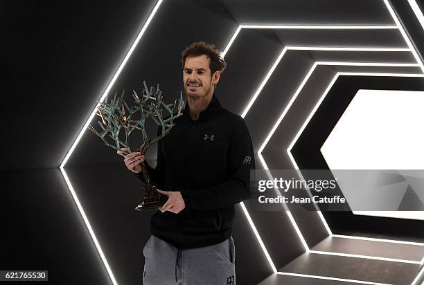 Winner Andy Murray of Great Britain holds the trophy following the final of the Paris ATP Masters Series 1000 at AccorHotel Arena aka Palais...