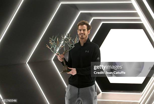 Winner Andy Murray of Great Britain holds the trophy following the final of the Paris ATP Masters Series 1000 at AccorHotel Arena aka Palais...