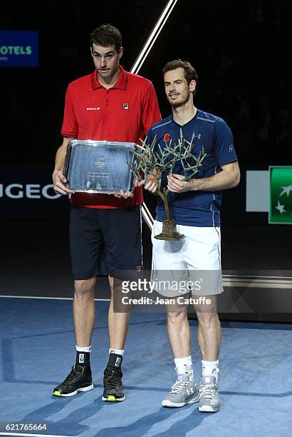 Finalist John Isner of USA and winner Andy Murray of Great Britain pose during the trophy presentation following the final of the Paris ATP Masters...