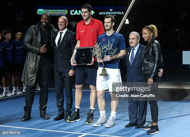 Presenter Teddy Riner, Director of tournament Guy Forget, finalist John Isner, winner Andy Murray of Great Britain, President of French Tennis...
