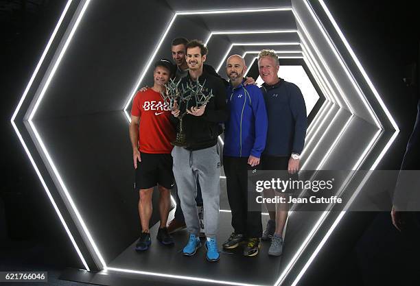 Andy Murray of Great Britain poses with his coaching team, Steven Kotze, Josh Murray, Jamie Delgado and Mark Bender following the final of the Paris...