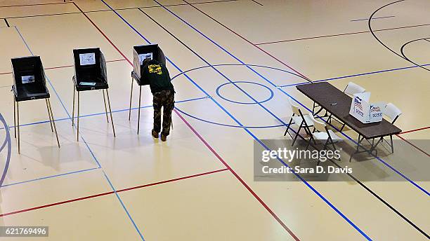 Man votes on November 8, 2016 in Durham, North Carolina. African American turn out to the polls was reporting low across the battleground state.