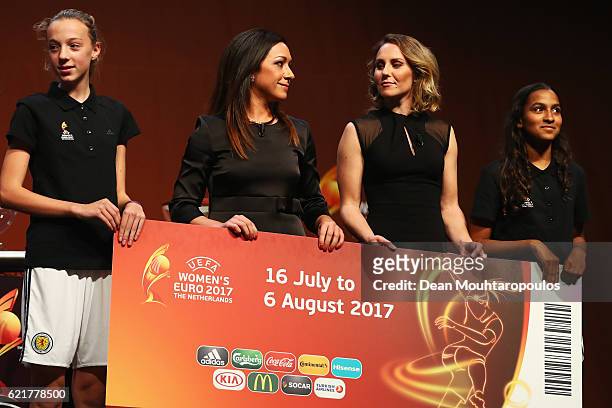 Women's EURO Final Tournament Draw Ambassador Nadine Kessler and Netherlands top scorer Manon Melis on stage with the dates and giant ticket during...