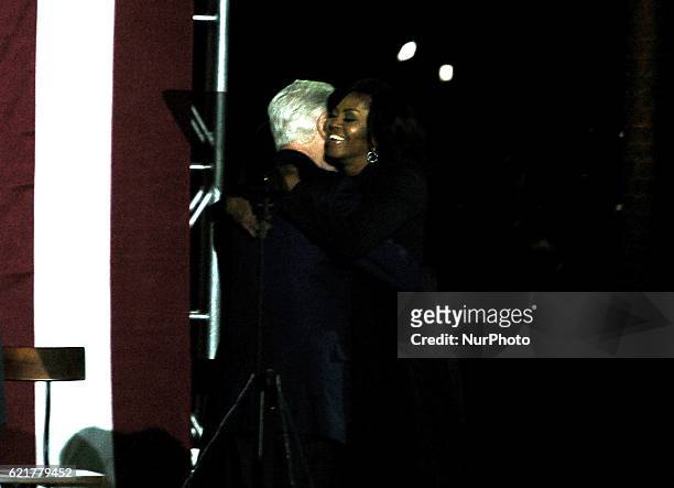 President Bill Clinton introduce First Lady Michelle Obama with a warm embrace as the two make one final plea for a Hillary Presidency in...