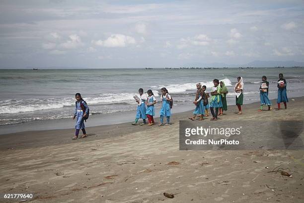 Dhaka, Bangladesh. November 5, 2016. Students are walking on the beach at Saint Martin Island, Bangladesh on November 5, 2016. Saint Martin Island...