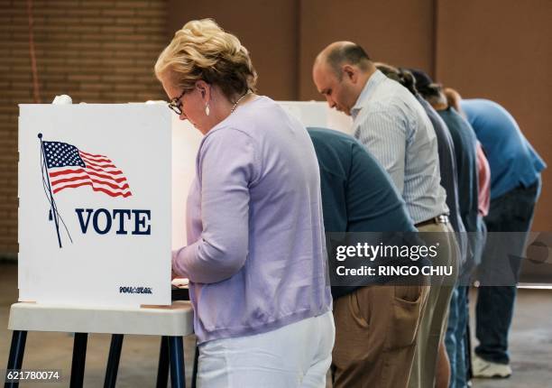 Voters cast their ballots in the US presidential election at a fire station in Alhambra, California, on November 8, 2016.