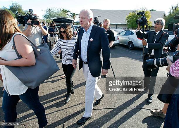 Sen. John McCain exits the Mountain View Christian Church polling place after casting his vote on November 8, 2016 in Phoenix, Arizona. Throughout...