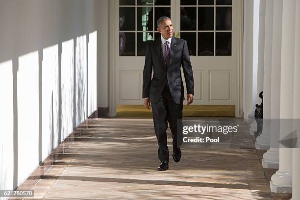 President Barack Obama walks from the Colonnade at The White House to the Oval Office on November 8, 2016. In Washington, DC. Obma spent part of the...