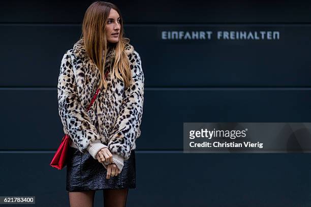 Fashion Blogger and Owner of SCIC Swimwear Sofia Grau wearing a leopard printed fake fur coat Express, a beige Sweater &other stories, a black...