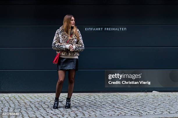 Fashion Blogger and Owner of SCIC Swimwear Sofia Grau wearing a leopard printed fake fur coat Express, a beige Sweater &other stories, a black...