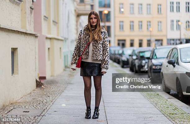 Fashion Blogger and Owner of SCIC Swimwear Sofia Grau wearing a leopard printed fake fur coat Express, a beige Sweater &other stories, a black...