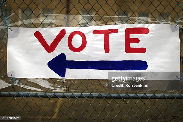 Handmade voting sign points the way to the polls on November 8, 2016 in Fort Worth, Texas. Americans across the nation make their choice for the next...