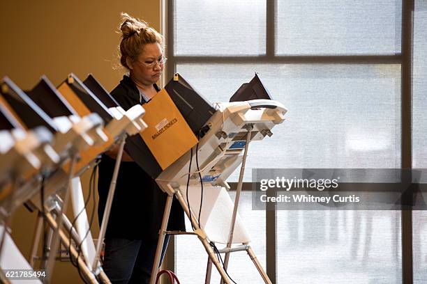 Taylor Salazar casts her electronic ballot on November 8, 2016 in Olathe, Kansas. After a contentious campaign season, Americans go to the polls...