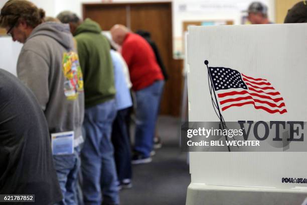 Voters cast ballots at a polling station at the Big Bear Lake Methodist Church in Big Bear, California, November 8, 2016.