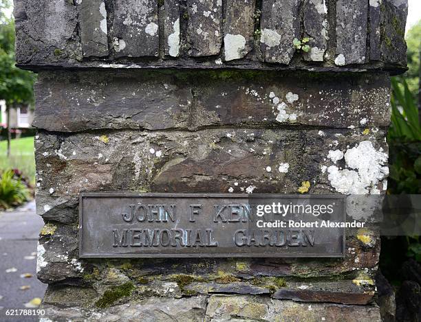 September 2, 2016: A metal plaque and stone pillar mark the entrance to the John F. Kennedy Memorial Garden in Clonakilty, Ireland. Two of the late...