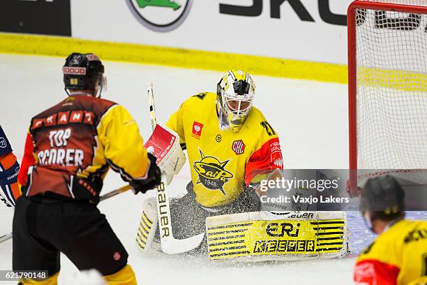 Jussi Markkanen of SaiPa Lappeenranta is making a glove save during the Champions Hockey League Round of 16 match between Vaxjo Lakers and SaiPa...