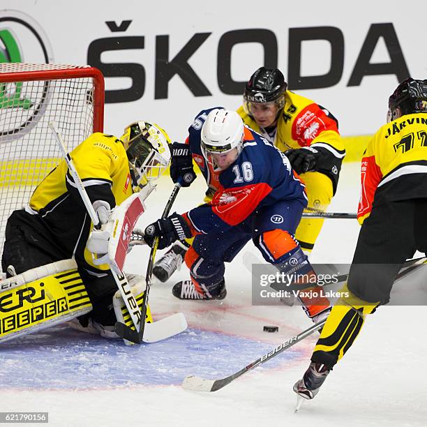 Geoff Platt of Vaxjo Lakers challenges Jussi Markkanen of SaiPa Lappeenranta during the Champions Hockey League Round of 16 match between Vaxjo...