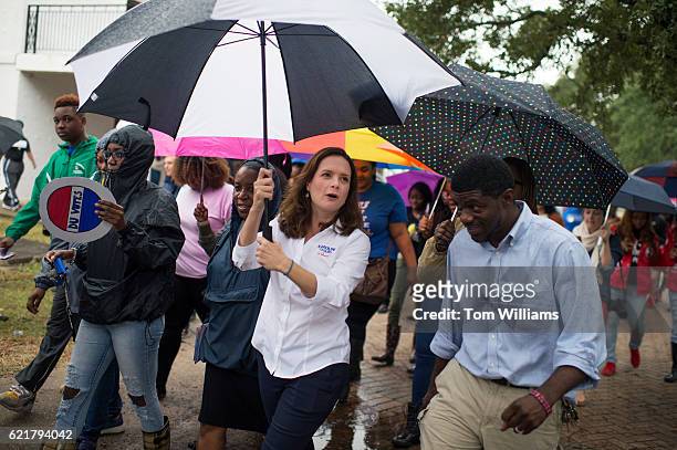 Caroline Fayard, Democratic candidate for the U.S. Senate from Louisiana, walks with Dillard University students while they march to their polling...