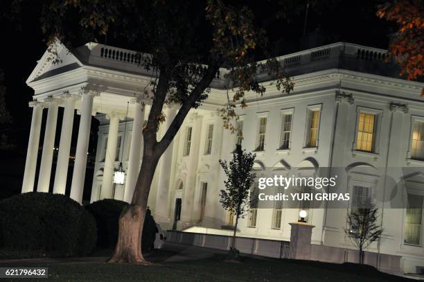 The White House is seen during the US presidential election night on November 8, 2016 in Washington,DC. Millions of Americans turned out Tuesday to...