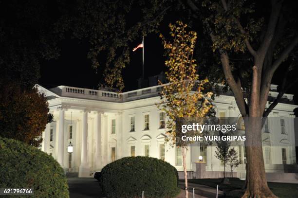 The White House is seen during the US presidential election night on November 8, 2016 in Washington,DC. Millions of Americans turned out Tuesday to...