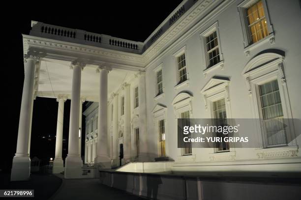 The White House is seen during the US presidential election night on November 8, 2016 in Washington,DC. Millions of Americans turned out Tuesday to...