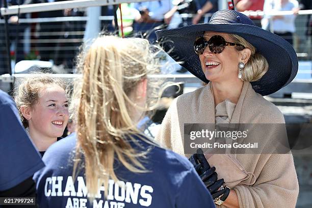 Queen Maxima of The Netherlands speaks to students during her visit to the Spirit of New Zealand Youth Training Vessel at Princes Wharf on November...