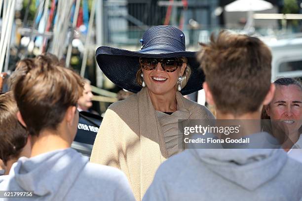 Queen Maxima of The Netherlands speaks to students during her visit to the Spirit of New Zealand Youth Training Vessel at Princes Wharf on November...