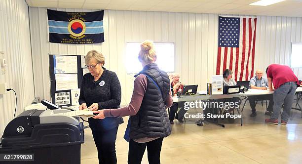 Voters head to the polling place on November 8, 2016 in Redfield, Iowa. Americans today will choose between Republican presidential candidate Donald...