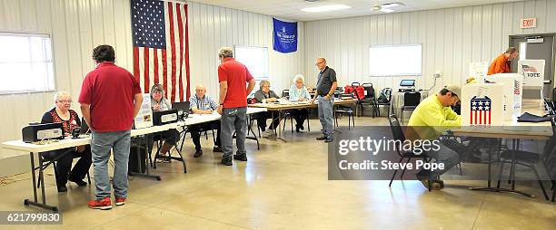 Voters head to the polling place on November 8, 2016 in Redfield, Iowa. Americans today will choose between Republican presidential candidate Donald...