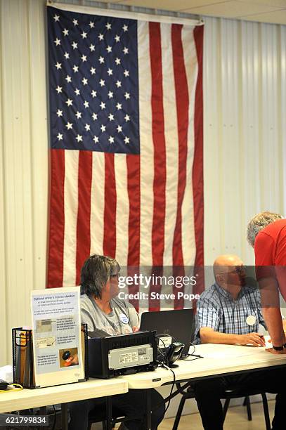 Voters head to the polling place on November 8, 2016 in Redford, Iowa. Americans today will choose between Republican presidential candidate Donald...