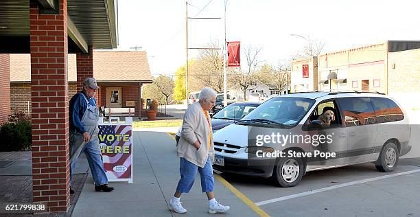 Voters head to the polling place on November 8, 2016 in Redfield Iowa. Americans today will choose between Republican presidential candidate Donald...