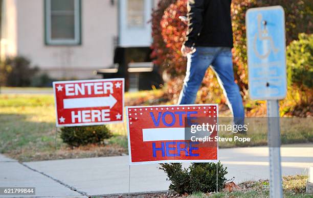 Iowa voters head to polling locations in expected record numbers on November 8, 2016 in Woodward, Iowa. Americans today will choose between...