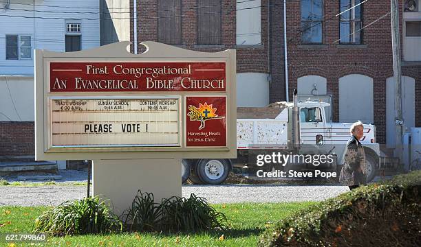 Voters head to the polling place on November 8, 2016 in Stuart, Iowa. Americans today will choose between Republican presidential candidate Donald...