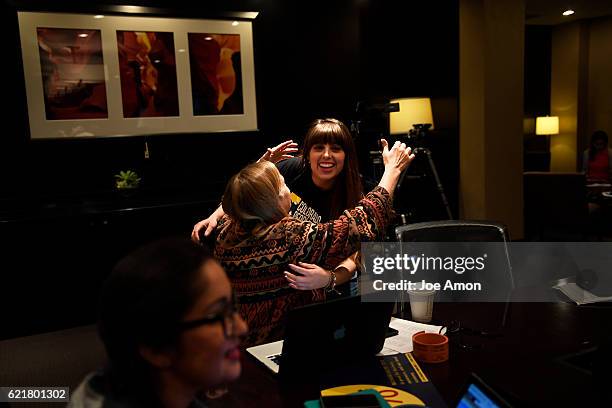 Jenny Davies is hugged by Lizeth Chacon, co-chair of the Colorado Families for a Fair Wage after coming inn from the field to watch for a decision on...