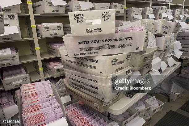 Boxes containing mail-in-ballots sit waiting to be sorted at the San Francisco City Hall polling location in San Francisco, California, U.S., on...