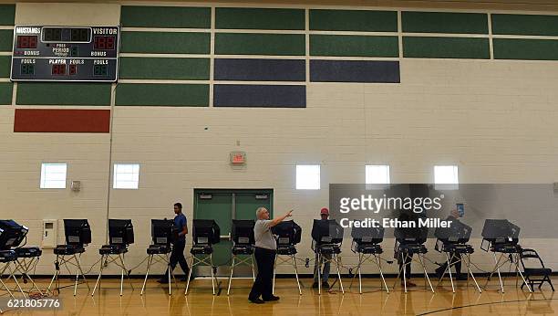 Voters cast their ballots at voting machines at Shadow Ridge High School on Election Day on November 8, 2016 in Las Vegas, Nevada. Americans across...