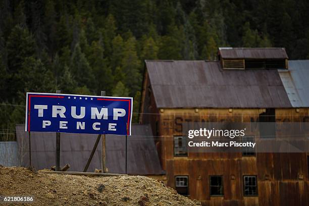 Trump/Pence sign stands along Interstate 70 outside the shuttered Stanley Mines Company building on November 8, 2016 in Idaho Springs, Colorado....